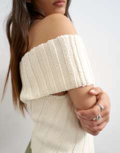 Model wearing Knitted one shoulder asymmetric top in ivory