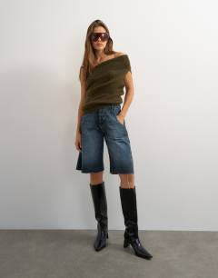 Model wearing Knitted one shoulder draped top in khaki