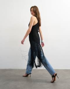Model wearing Knitted one shoulder tassel top in black