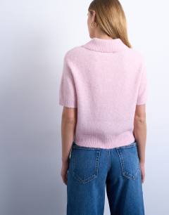 Model wearing Knitted open button detail cardigan in light pink