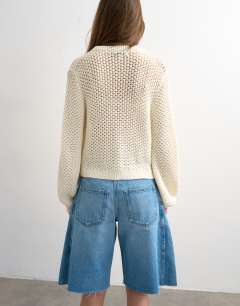 Model wearing Knitted open stitch cardigan in ivory