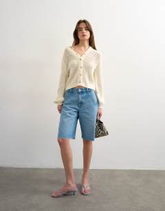 Model wearing Knitted open stitch cardigan in ivory