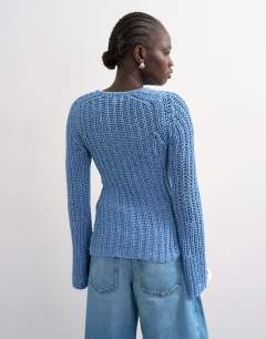 Model wearing Knitted open stitch long sleeved top in blue