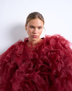Model wearing Knitted organza extreme texture cardigan in burgundy