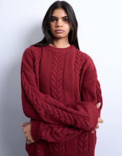 Model wearing Knitted oversized cable and wide rib jumper in deep red 