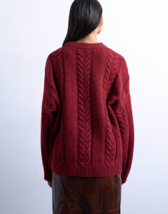 Model wearing Knitted oversized cable and wide rib jumper in deep red 