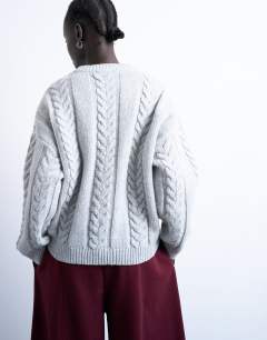 Model wearing Knitted oversized cable and wide rib jumper in grey
