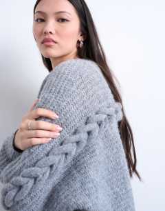 Model wearing Knitted oversized cable sleeve slouchy cardigan in grey
