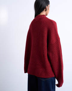 Model wearing Knitted oversized clean wide neck rib jumper in rust