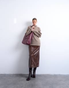 Model wearing Knitted oversized high neck jumper in espresso