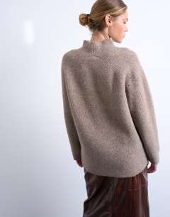 Model wearing Knitted oversized high neck jumper in espresso