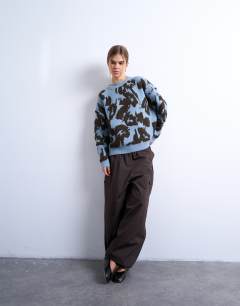 Model wearing Knitted oversized looped textured print jumper in blue