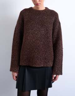 Model wearing Knitted oversized tinsel wide sleeve jumper in brown