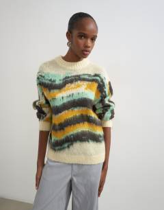 Model wearing Knitted painted stripe crew neck jumper in multi