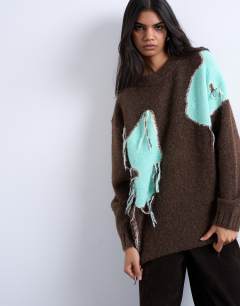Model wearing Knitted placement floral tassel jumper in chocolate