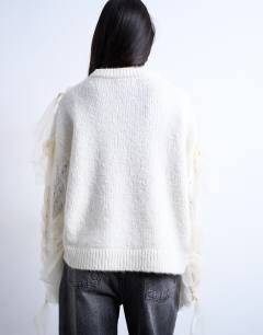 Model wearing Knitted plaid ribbon jumper in Ivory