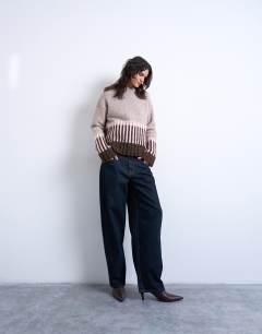 Model wearing Knitted plated jumper in pink