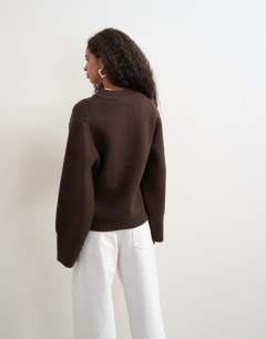 Model wearing Knitted pocket front cardigan in brown