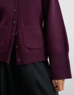 Model wearing Knitted pocket front cardigan in mulberry