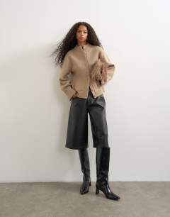 Model wearing Knitted pocket front cardigan in oat