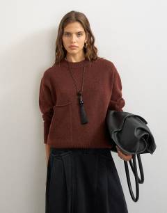 Model wearing Knitted pocket jumper in cinnamon