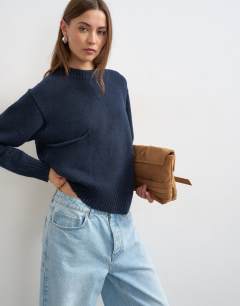 Model wearing Knitted pocket jumper in midnight