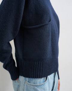 Model wearing Knitted pocket jumper in midnight