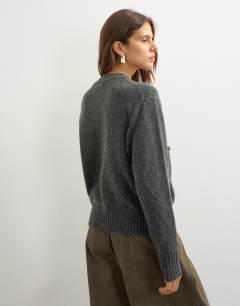 Model wearing Knitted pocket jumper in smoke