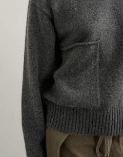 Model wearing Knitted pocket jumper in smoke
