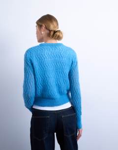 Model wearing Knitted pointelle cardigan in blue