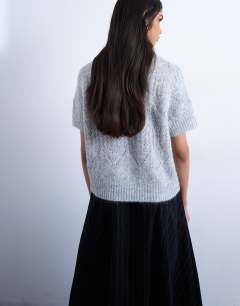 Model wearing Knitted pointelle short sleeve top in grey