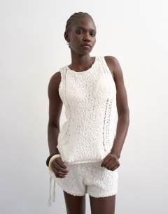 Model wearing Knitted pointelle vest co-ord in ivory