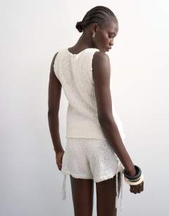 Model wearing Knitted pointelle vest co-ord in ivory
