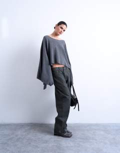 Model wearing Knitted poncho in charcoal