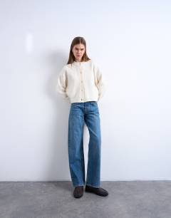 Model wearing Knitted premium 100% lambswool cardigan in ivory