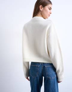 Model wearing Knitted premium 100% lambswool cardigan in ivory