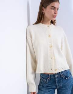 Model wearing Knitted premium 100% lambswool cardigan in ivory