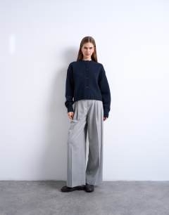 Model wearing Knitted premium 100% lambswool cardigan in navy