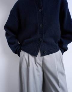 Model wearing Knitted premium 100% lambswool cardigan in navy