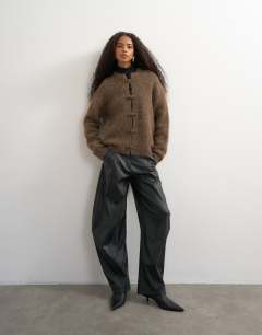 Model wearing Knitted premium alpaca blend frogging detail cardigan in dark brown