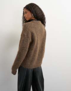 Model wearing Knitted premium alpaca blend frogging detail cardigan in dark brown