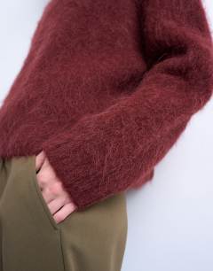 Model wearing Knitted premium alpaca crew neck boxy jumper in Burgundy
