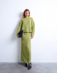Model wearing Knitted premium alpaca crew neck boxy jumper in green