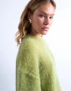 Model wearing Knitted premium alpaca crew neck boxy jumper in green