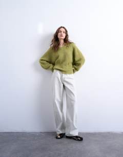 Model wearing Knitted premium alpaca  v neck jumper in avacado