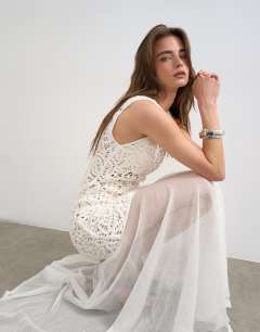 Model wearing Knitted premium crochet full skirt dress in ecru