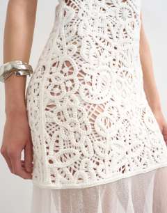 Model wearing Knitted premium crochet full skirt dress in ecru