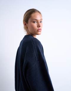Model wearing Knitted premium lambswool jumper in navy