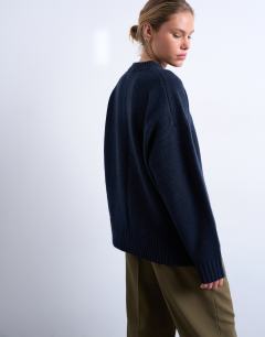 Model wearing Knitted premium lambswool jumper in navy