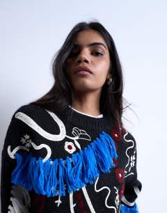 Model wearing Knitted premium oversized embroidered jumper in black